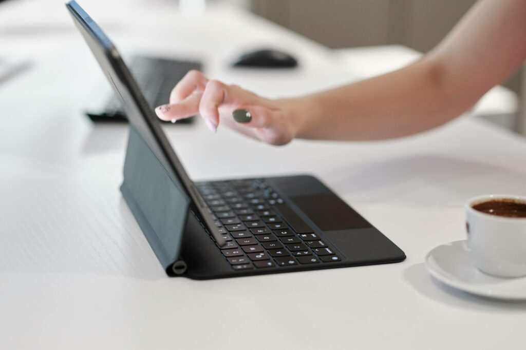 Hand pointing into the device screen 